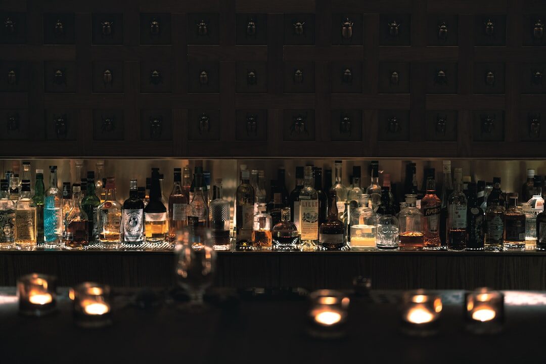 Cocktail bar counter glowing with warm lights at night